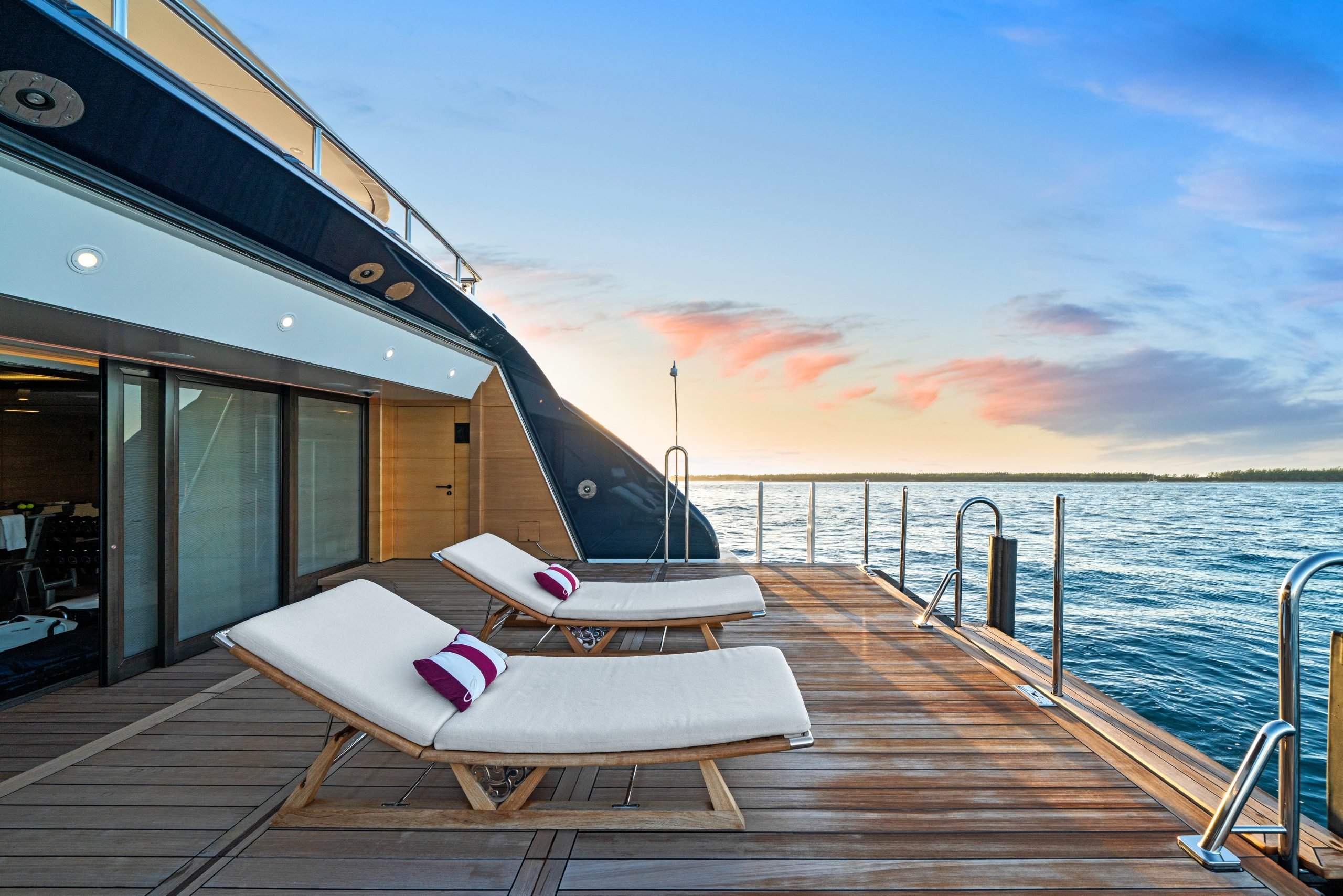 Sun loungers on the swim platform of the superyacht Amaryllis at sunset